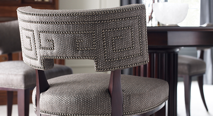 Detail image of a chair with decorative nail trim