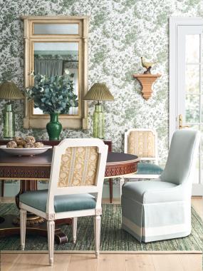 Room Scene: HC5341-70/HC5342-70 Gustav Dining Table shown in Truffle finish with optional solid gold striping; HC6708-02 Kathryn Dining Chair shown in PE6539-52 fabric on seat and HC810-27-LIBERTY fabric on inside and outside back and Heritage White finish; HC6706-02 Evelyn Kick Pleat Dining Chair shown in Hc4029-32 fabric with HC2393-10 welt and GB-58854/04 Veranda Linen Crete tape on base of skirt and HC6491-70 Alexis Console shown in Oxford finish.