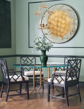 HC2551-10 Fretwork Arm Chair shown in leather HC140 with Black Lacquer finish and HCP9121-STK Bask Dining Table shown in Bask Brass finish.