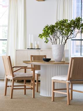 Room Scene:  HC1346-70W Landers Dining Table shown in Dove White paint base with Scrubbed Ash top, HC1312-01 Aix-en-Provence Arm Chair and HC1312-02 Side Chair shown in optional Clear Coat Lacquer in fabric HC2393-10 and HC1393-70 Verdun Tall Cabinet in Alabaster paint.