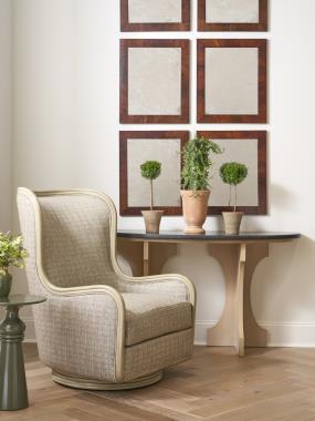 Room Scene: HC3428-27 Seagate Swivel Lounge Chair shown in HC3272-16 fabric with Weathered French Grey finish; HC3519-70 Oliver Trestle Console shown in Baja finish and HC3523-70 Priscilla Accent Table shown in Match Finish Panel MFP.