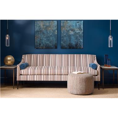 Room Scene: HC4605-51-6 Frederick M2M® 85"-96" shown in HC462-46 fabric with bolsters HC446-36 fabric and Kohl finish;  HC2686-80S Fyn Side Table with Stone and PE6517-50 Maisie Ottoman Shown in HC459-34 fabric.